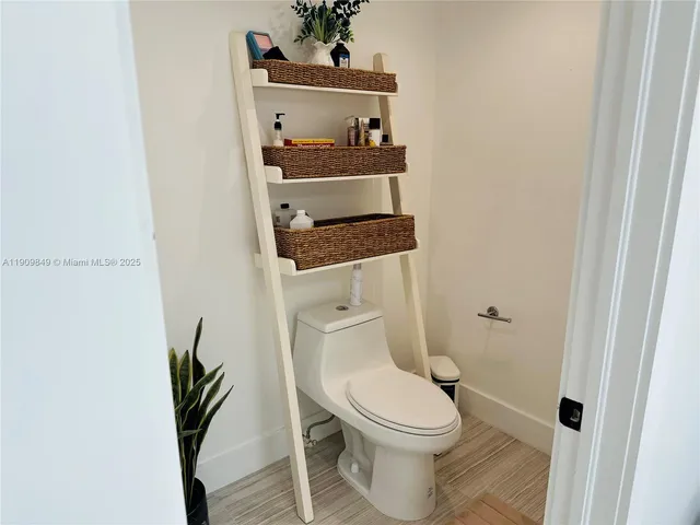 a bathroom with a toilet and a sink