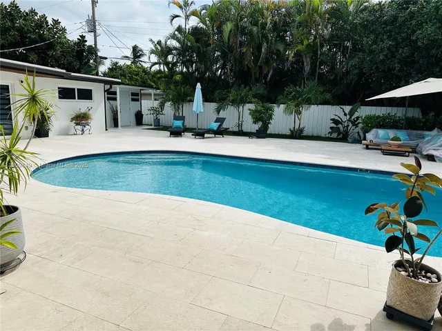 a view of a backyard with a patio