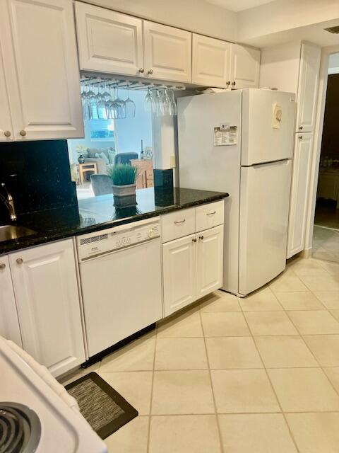 Undisclosed Address Boca Raton, FL 33487 - Photo 13 of 45 a kitchen with stainless steel appliances a refrigerator sink and cabinets