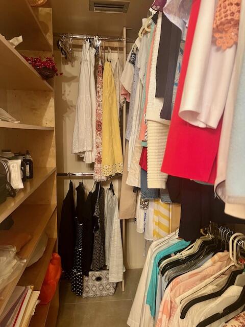 Undisclosed Address Boca Raton, FL 33487 - Photo 21 of 45 a view of walk in closet with clothes and shoes