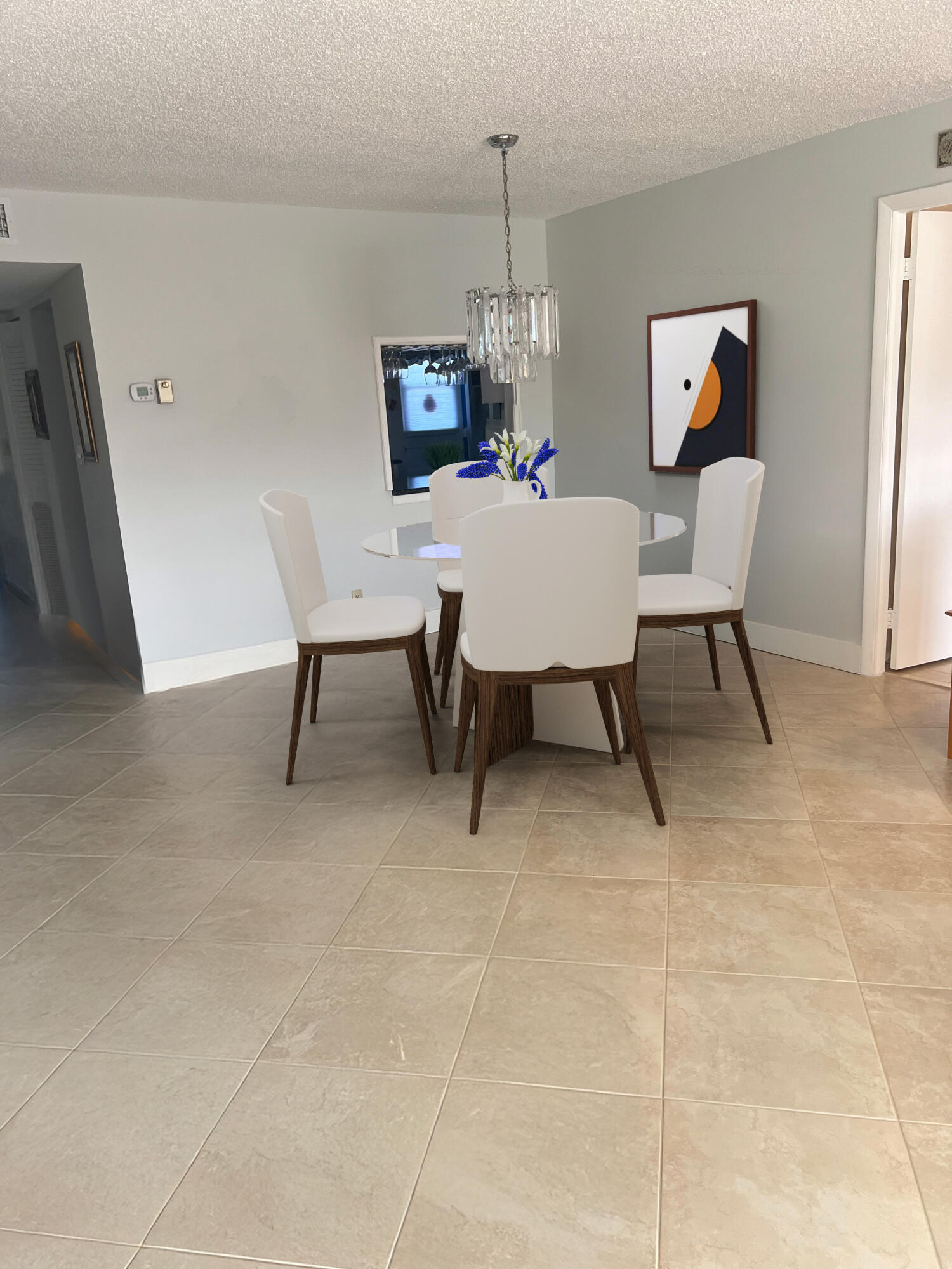 Undisclosed Address Boca Raton, FL 33487 - Photo 5 of 45 a view of a dining room with a table and chairs