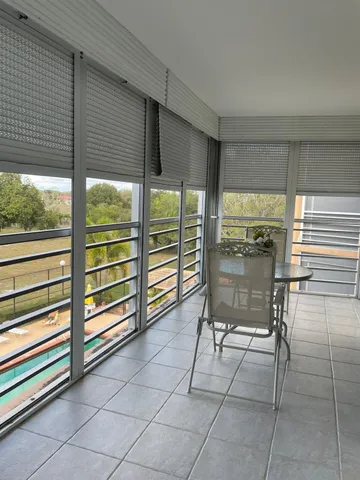 a kitchen with granite countertop white cabinets and stainless steel appliances