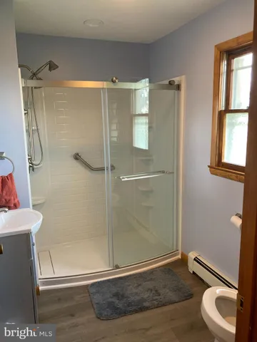 a view of walk in closet with clothes