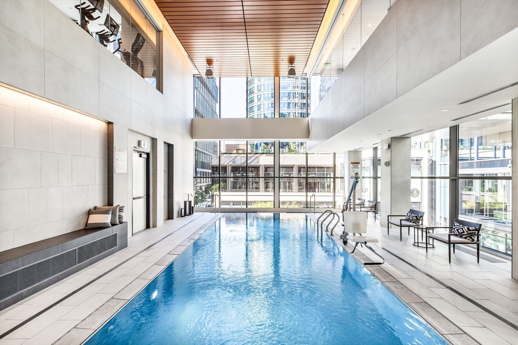 135 Seaport Boulevard, Unit 1503 Boston, MA 02210 - Photo 21 of 27 a view of spacious living room with wooden floor