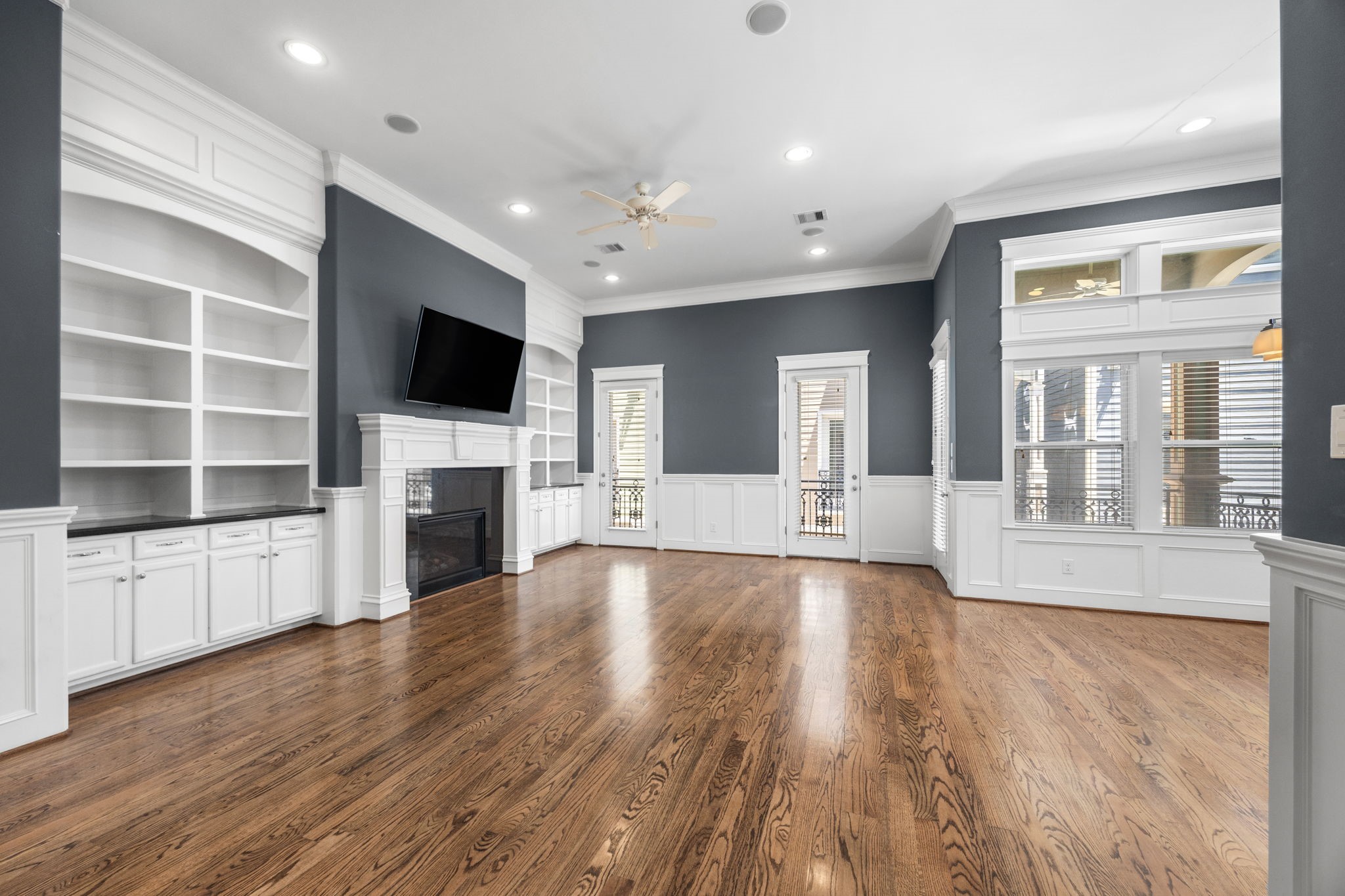 619 Rutland Street, Unit B Houston, TX 77007 - Photo 6 of 33 a view of an empty room with a fireplace and a window