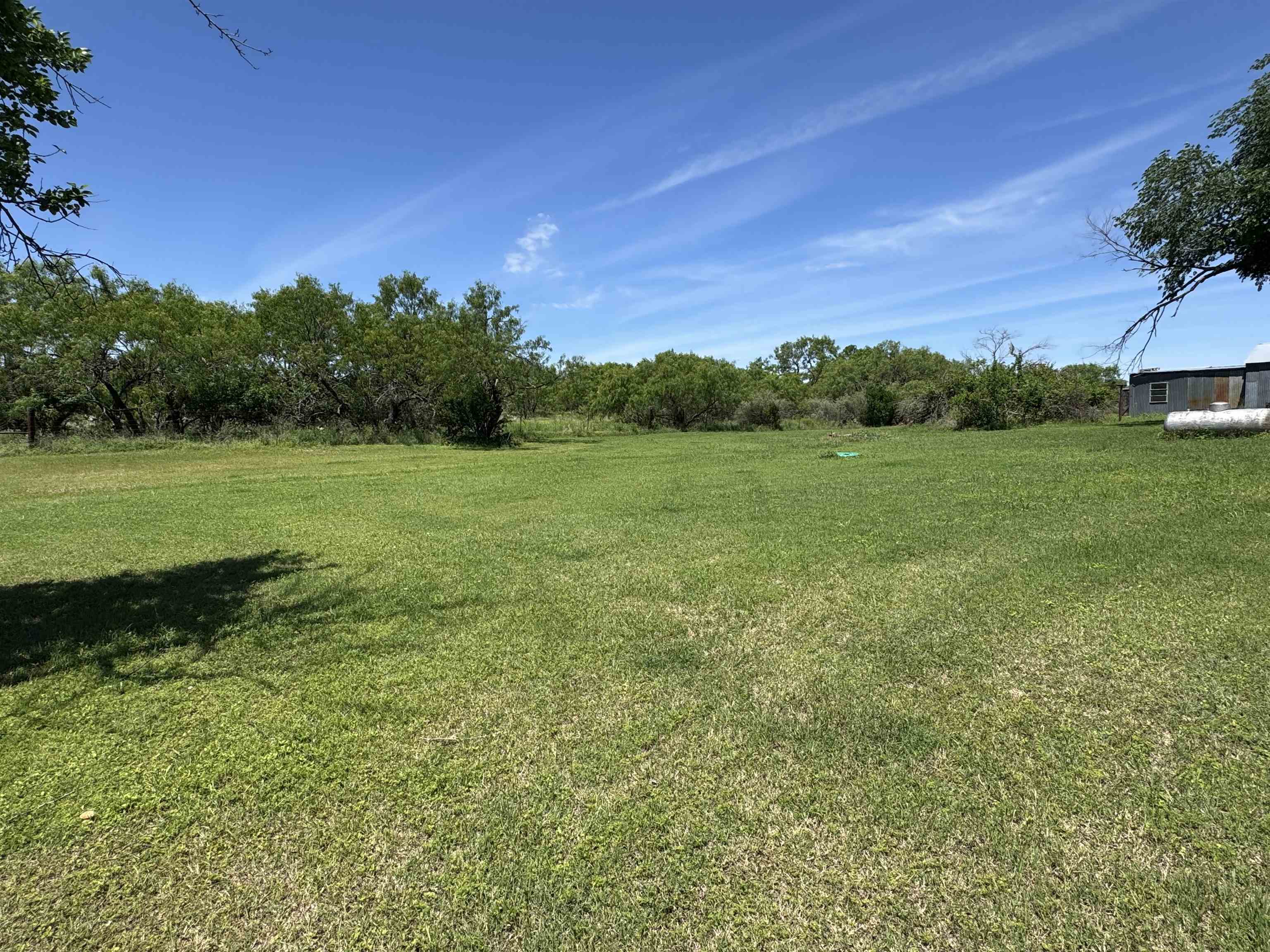 635 Village Loop Tow, TX 78672 - Photo 18 of 27 a view of field with tall trees