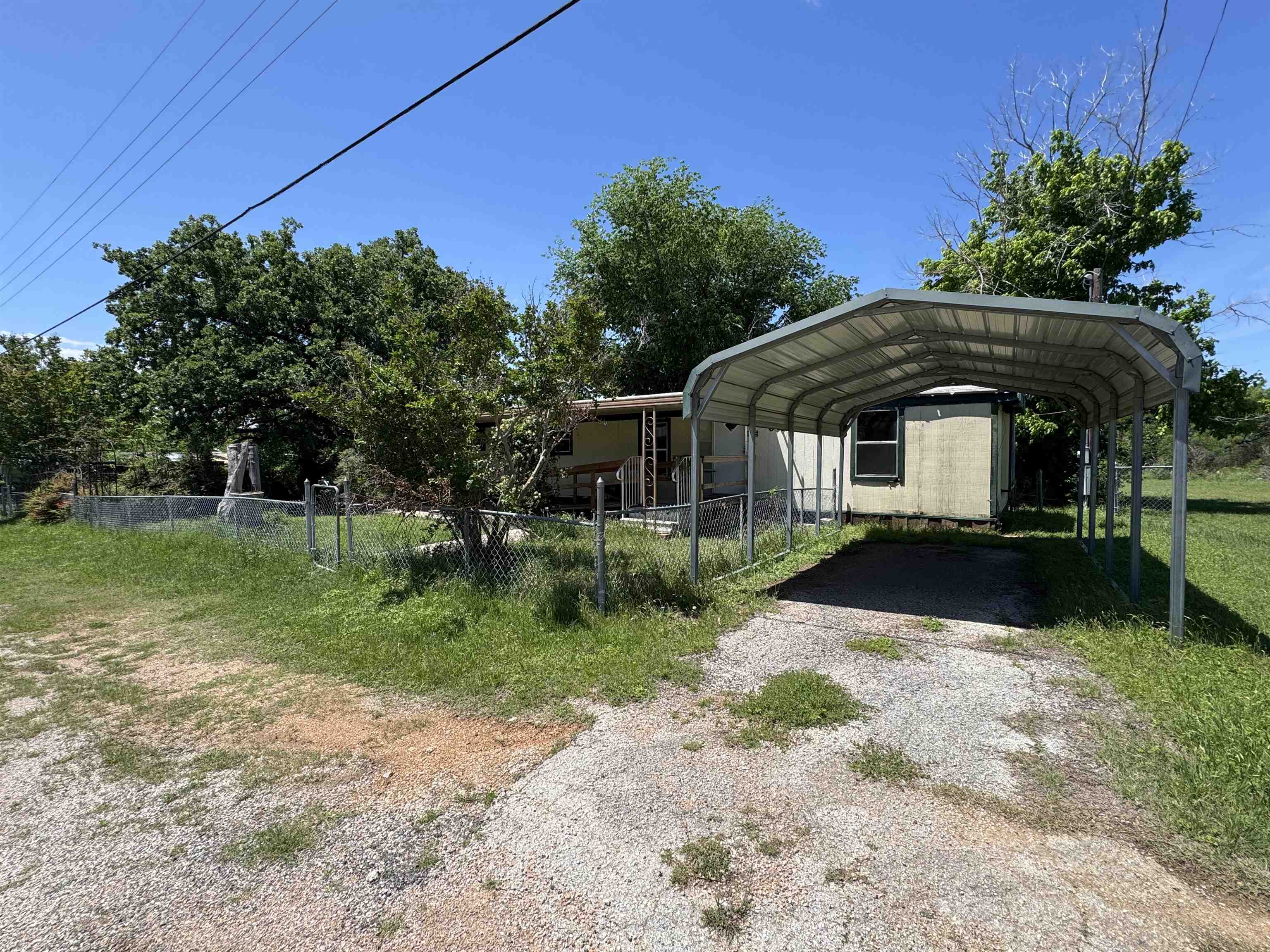 635 Village Loop Tow, TX 78672 - Photo 2 of 27 a front view of a house with a yard