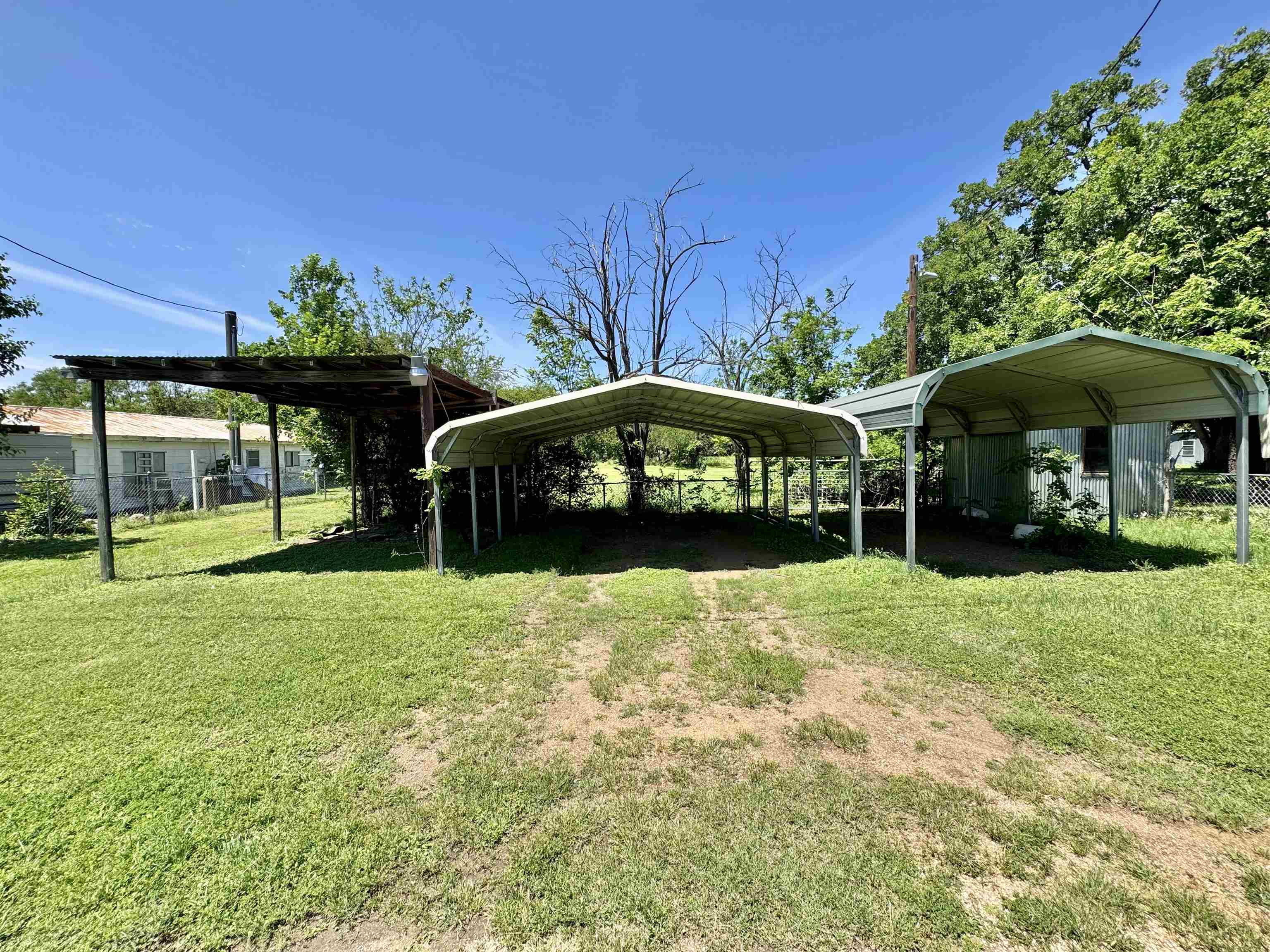 635 Village Loop Tow, TX 78672 - Photo 3 of 27 a view of a house with backyard and sitting area