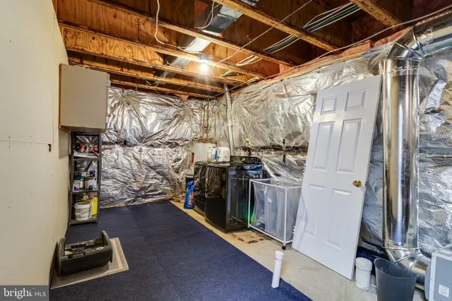 a bedroom with a bed and a night stand