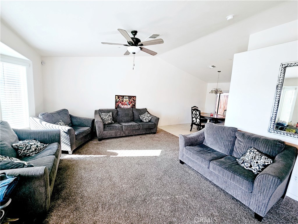 301 Moonstone Beach Court Delano, CA 93215 - Photo 13 of 31 a living room with furniture and a couch