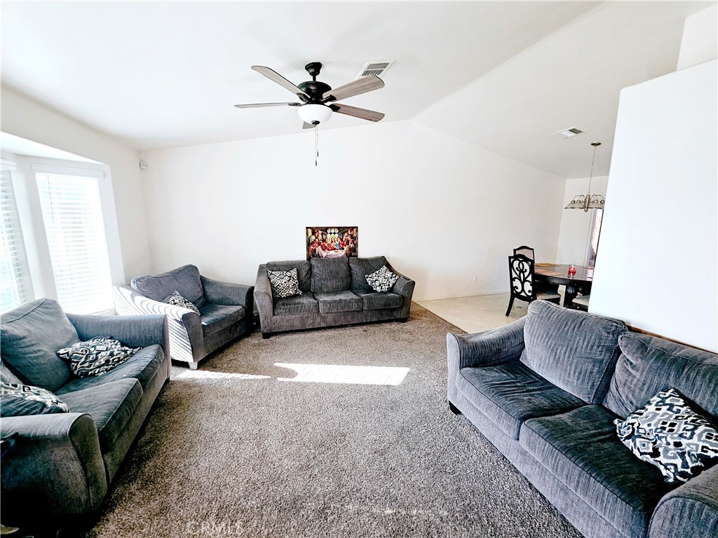 301 Moonstone Beach Court Delano, CA 93215 - Photo 14 of 31 a living room with furniture and a large window