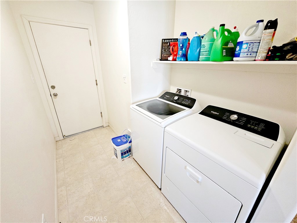 301 Moonstone Beach Court Delano, CA 93215 - Photo 16 of 31 a utility room with dryer and washer
