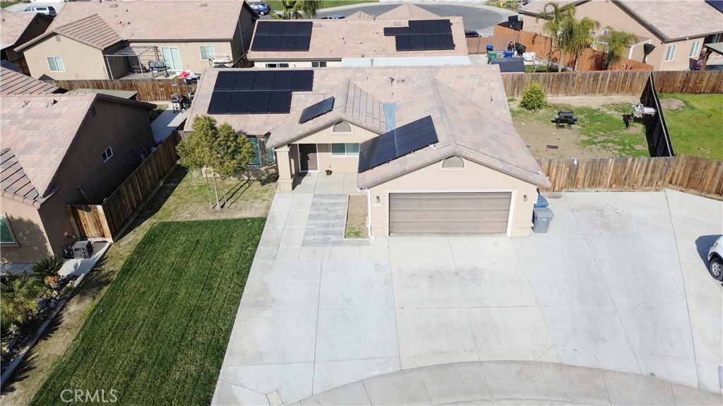301 Moonstone Beach Court Delano, CA 93215 - Photo 29 of 31 an aerial view of a house with a yard