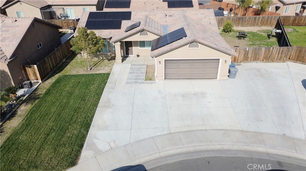 301 Moonstone Beach Court Delano, CA 93215 - Photo 30 of 31 a view of house with a yard