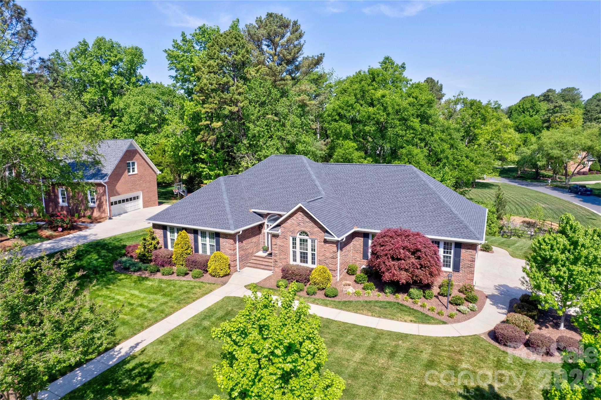 1188 Fawn Ridge Road Northwest Concord, NC 28027 - Photo 3 of 38 a aerial view of a house with a yard and potted plants