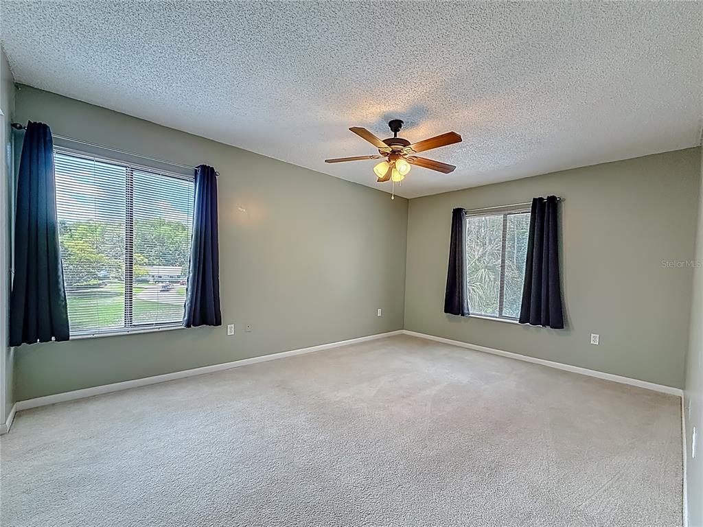 1372 Pine Ridge Circle East, Unit H3 Tarpon Springs, FL 34688 - Photo 24 of 53 a view of an empty room with a window