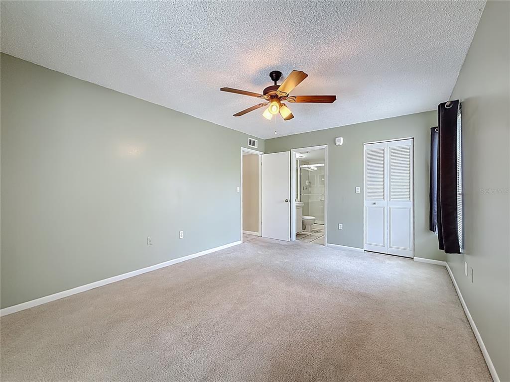 1372 Pine Ridge Circle East, Unit H3 Tarpon Springs, FL 34688 - Photo 26 of 53 a view of an empty room with a window