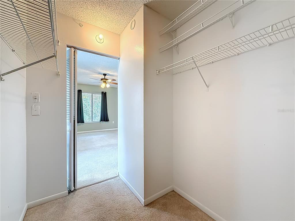 1372 Pine Ridge Circle East, Unit H3 Tarpon Springs, FL 34688 - Photo 29 of 53 a view of a bathroom from a hallway