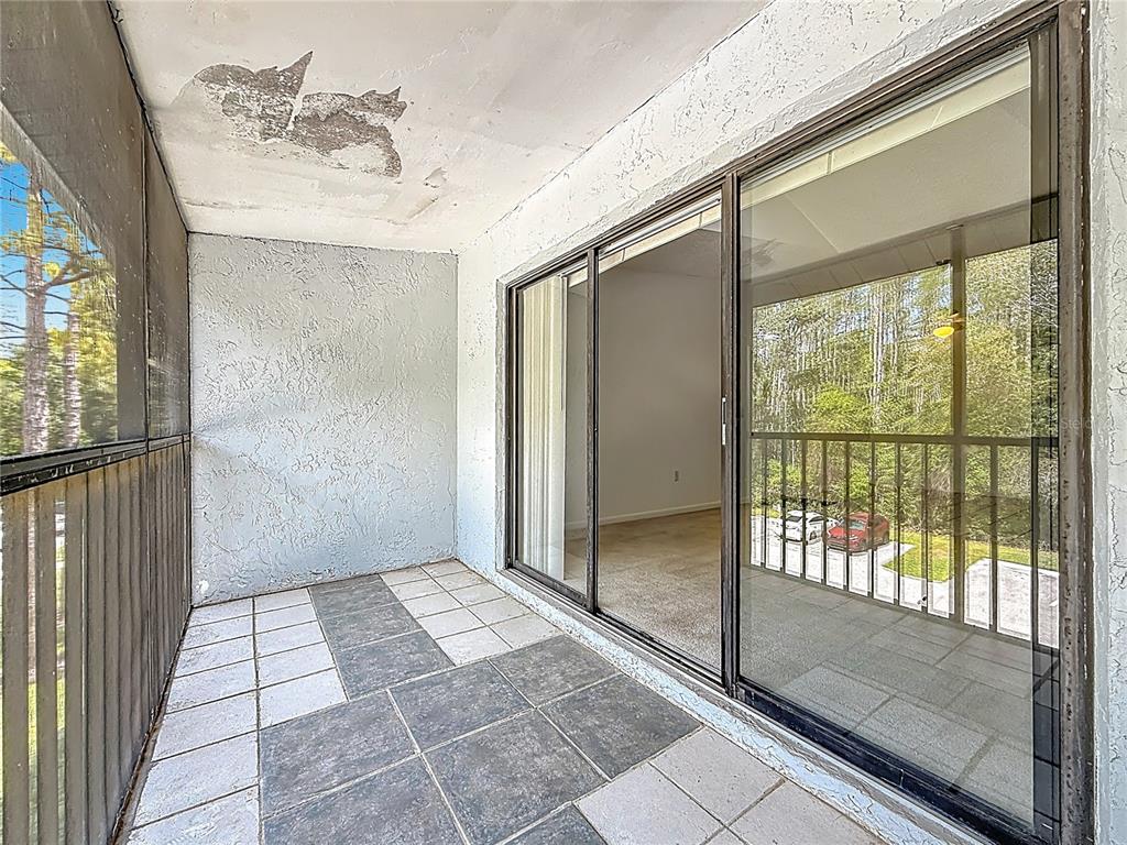 1372 Pine Ridge Circle East, Unit H3 Tarpon Springs, FL 34688 - Photo 36 of 53 a view of a bathroom with a glass door