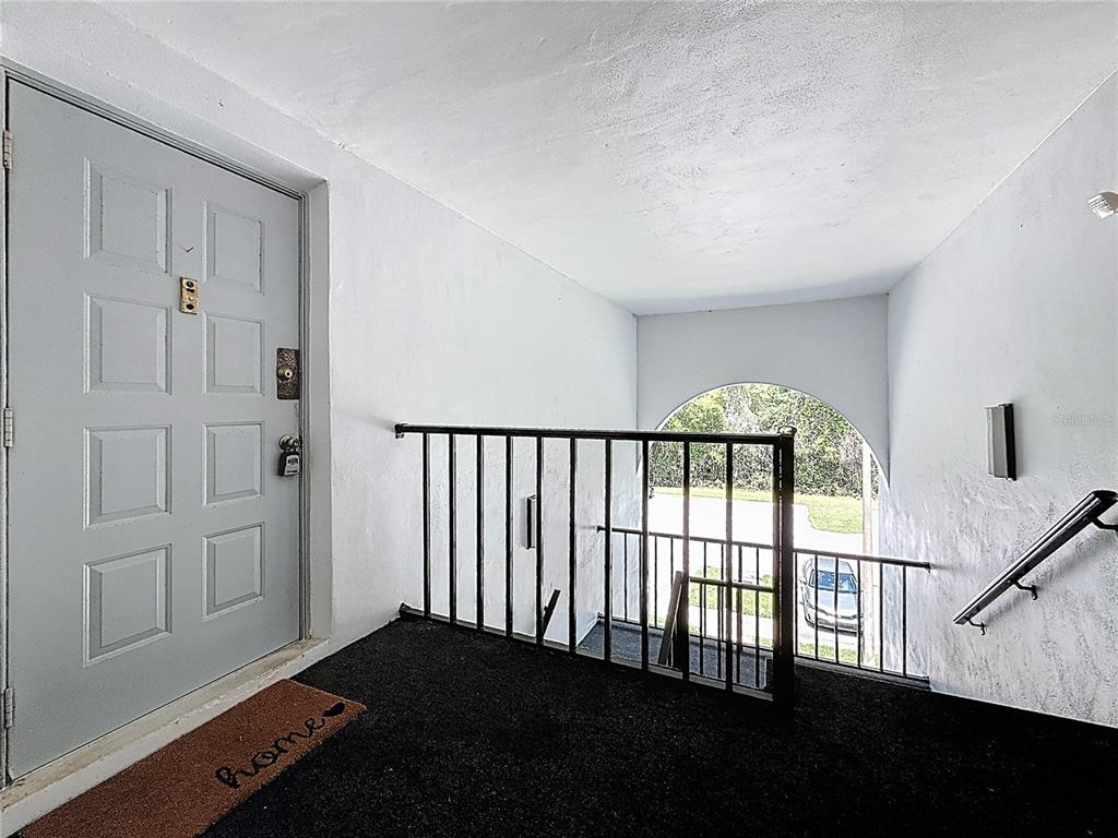 1372 Pine Ridge Circle East, Unit H3 Tarpon Springs, FL 34688 - Photo 6 of 53 wooden floor in an empty room