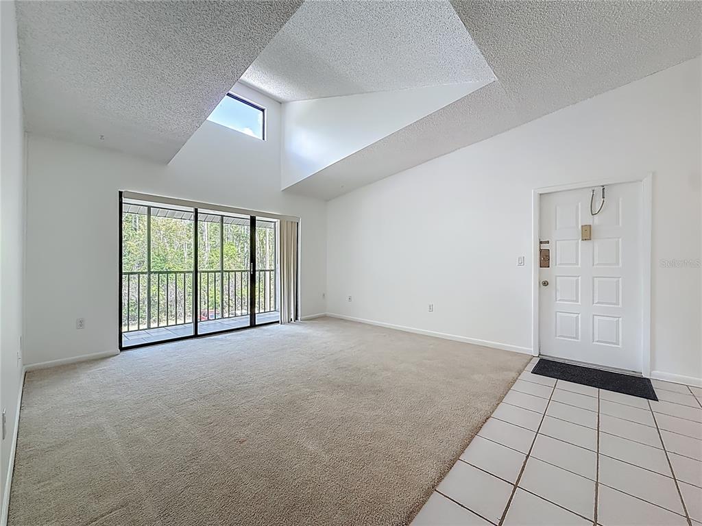 1372 Pine Ridge Circle East, Unit H3 Tarpon Springs, FL 34688 - Photo 9 of 53 a view of an empty room with a window