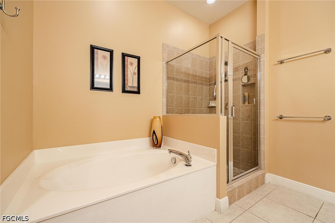2745 First Street, Unit 306 Fort Myers, FL 33916 - Photo 13 of 50 a bathroom with a bathtub and a shower