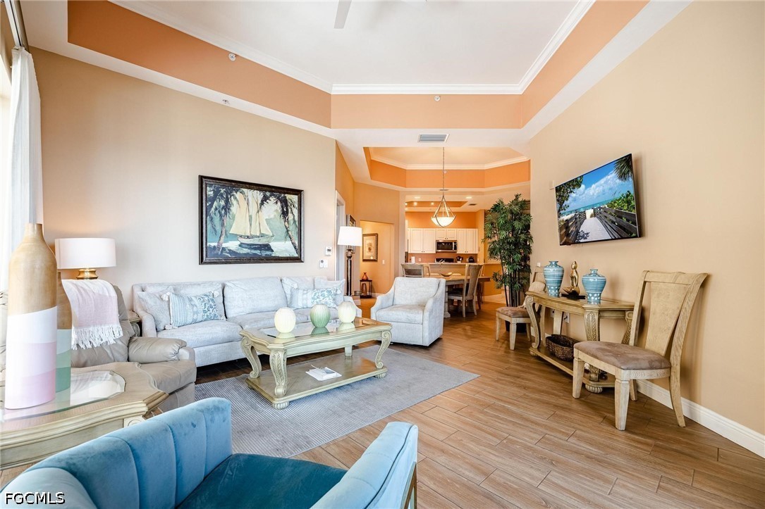 2745 First Street, Unit 306 Fort Myers, FL 33916 - Photo 17 of 50 a living room with furniture and a flat screen tv