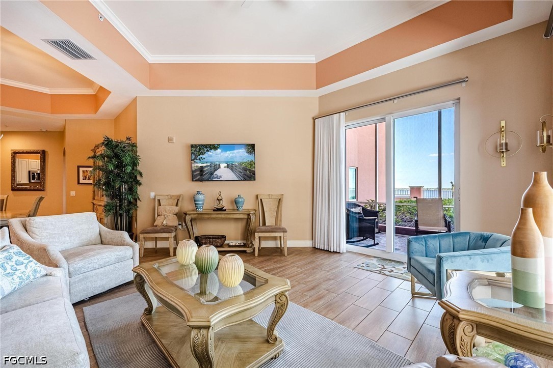 2745 First Street, Unit 306 Fort Myers, FL 33916 - Photo 18 of 50 a living room with furniture and a large window