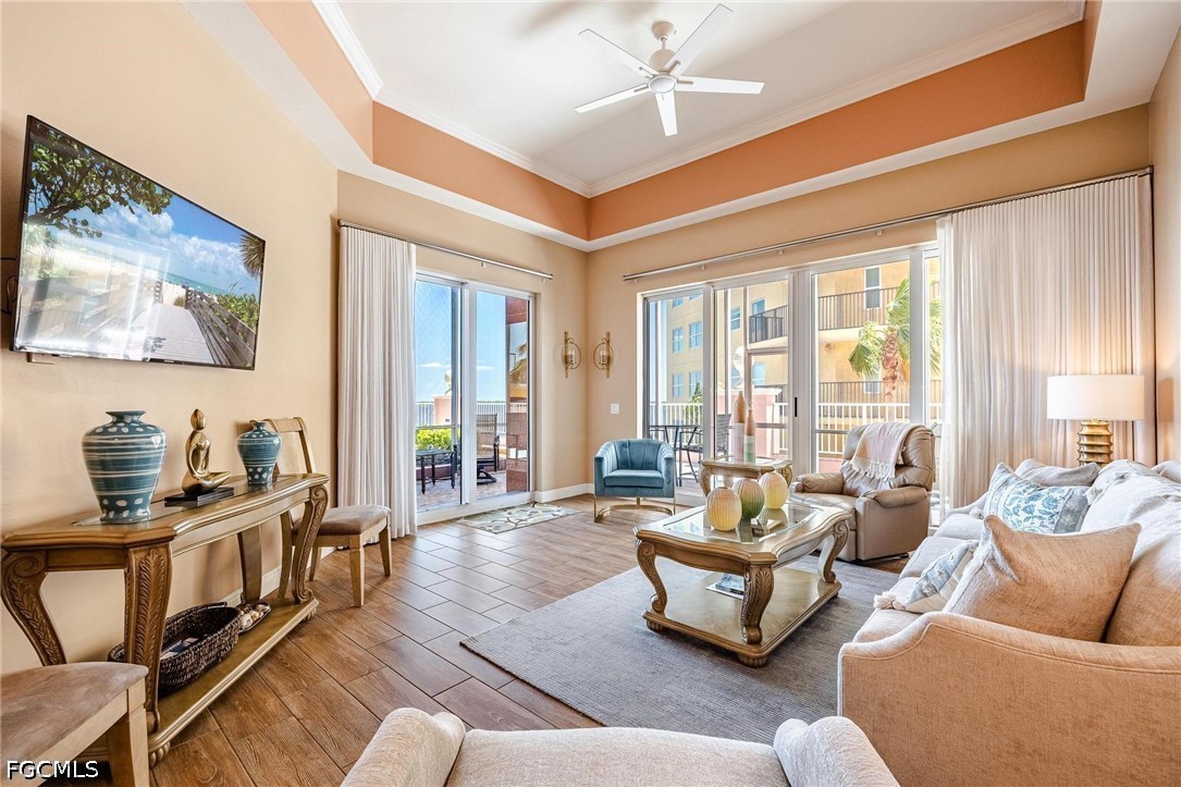 2745 First Street, Unit 306 Fort Myers, FL 33916 - Photo 19 of 50 a living room with furniture and floor to ceiling windows