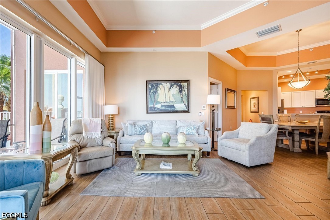 2745 First Street, Unit 306 Fort Myers, FL 33916 - Photo 2 of 50 a living room with furniture and a large window