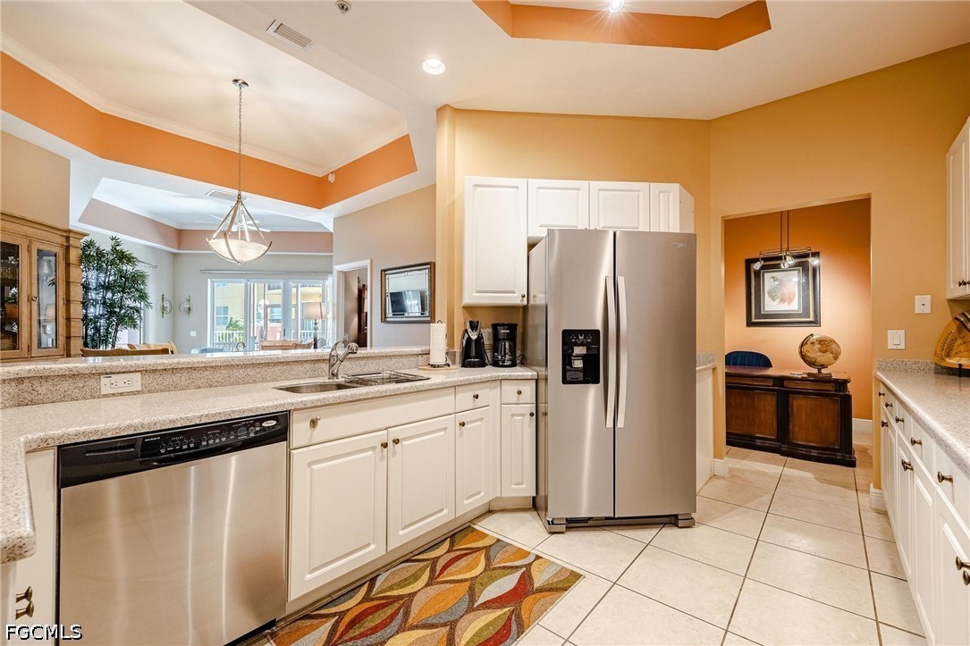 2745 First Street, Unit 306 Fort Myers, FL 33916 - Photo 23 of 50 a kitchen with stainless steel appliances a refrigerator sink and stove