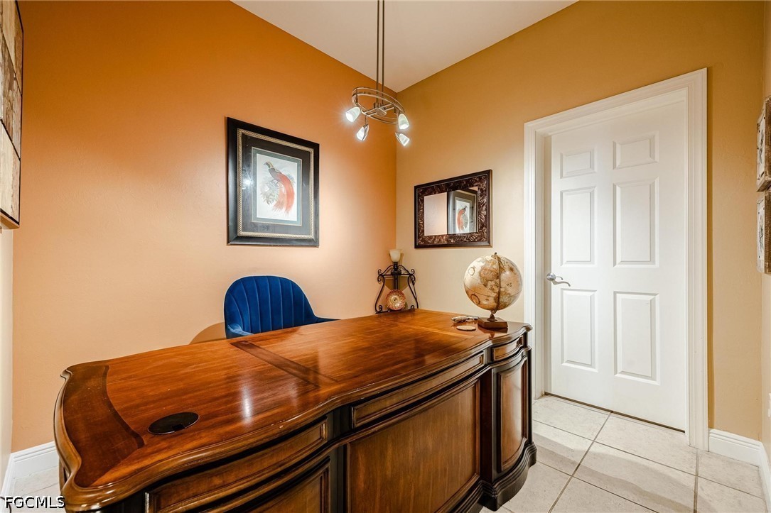 2745 First Street, Unit 306 Fort Myers, FL 33916 - Photo 26 of 50 a bedroom with a bed and wooden floor