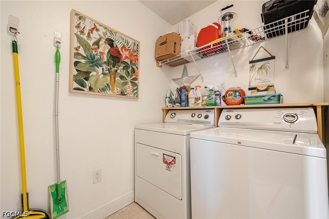 2745 First Street, Unit 306 Fort Myers, FL 33916 - Photo 34 of 50 a utility room with dryer and washer
