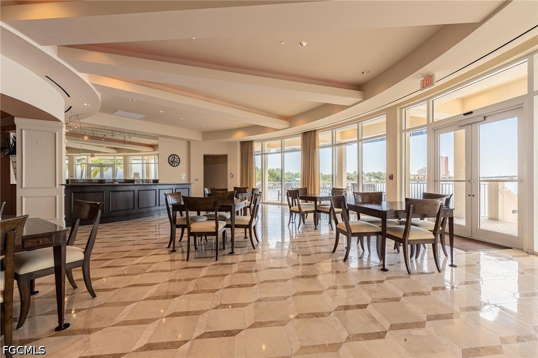 2745 First Street, Unit 306 Fort Myers, FL 33916 - Photo 39 of 50 a view of a dining room with furniture window and outside view