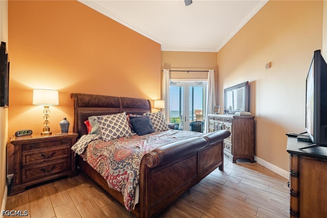 2745 First Street, Unit 306 Fort Myers, FL 33916 - Photo 5 of 50 a bedroom with a bed and a tv on table