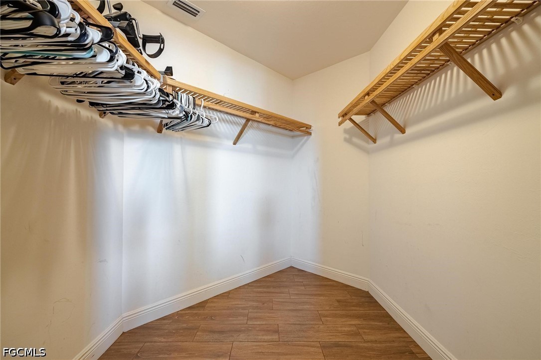 2745 First Street, Unit 306 Fort Myers, FL 33916 - Photo 7 of 50 a view of a room with racks on the wall
