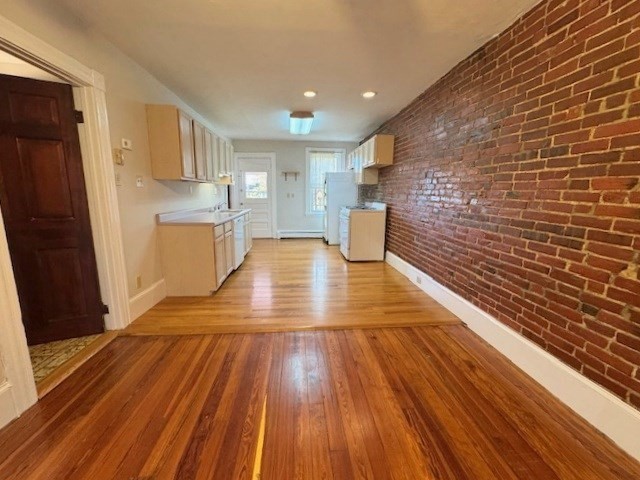 4 Mead Street, Unit 3 Boston, MA 02134 - Photo 4 of 20 a view of kitchen with cabinets and wooden floor