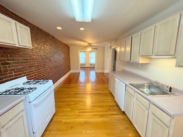 4 Mead Street, Unit 3 Boston, MA 02134 - Photo 5 of 20 a view of a kitchen with a sink and cabinets