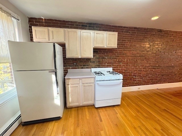 4 Mead Street, Unit 3 Boston, MA 02134 - Photo 6 of 20 a kitchen with a refrigerator and a stove
