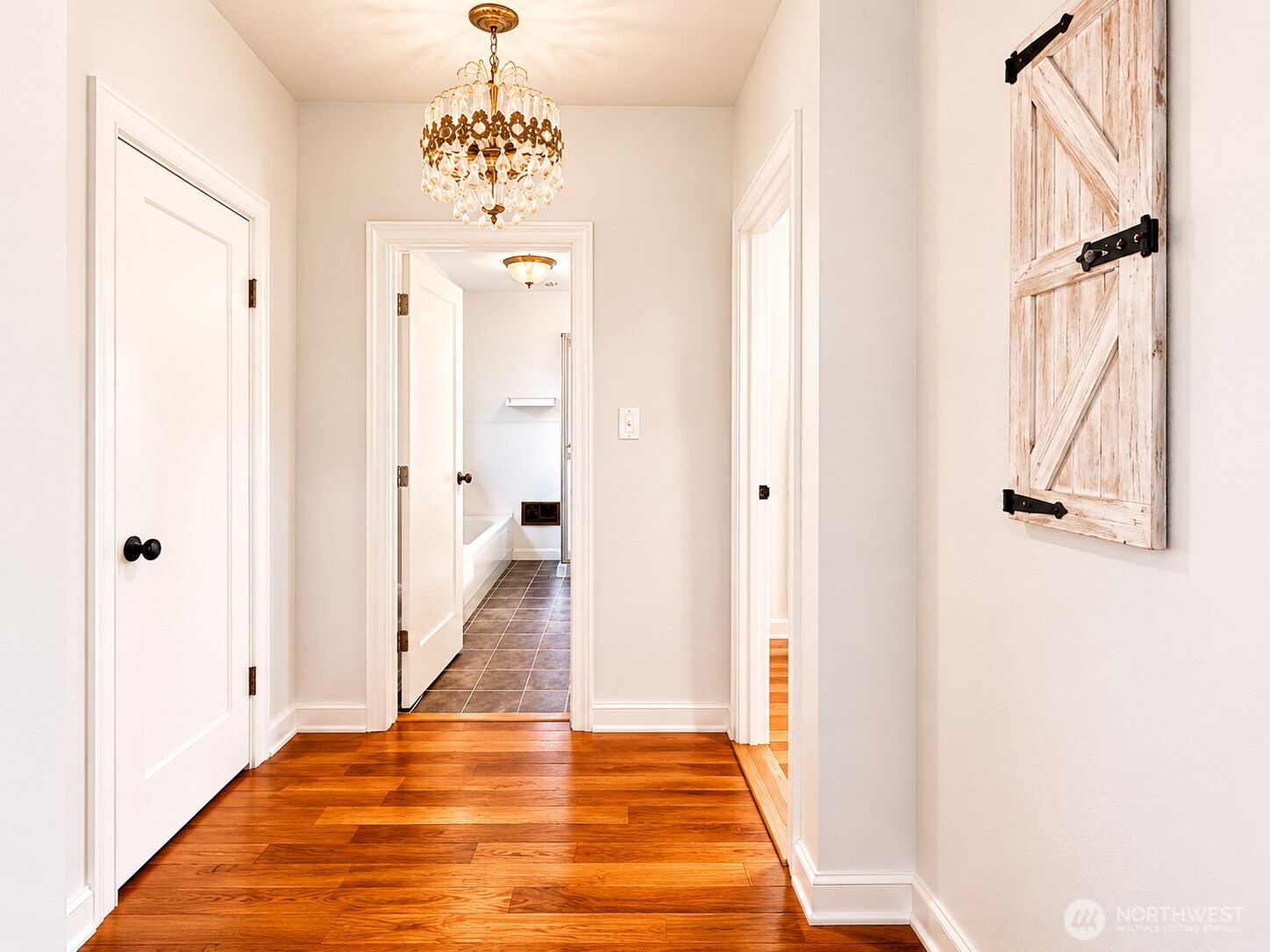 2154 Cranberry Road Grayland, WA 98547 - Photo 15 of 38 a view of a hallway with wooden floor and staircase