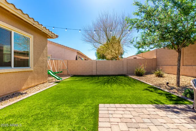 a backyard of a house with seating space