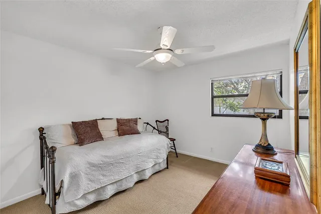 a bedroom with bed and a flat screen tv