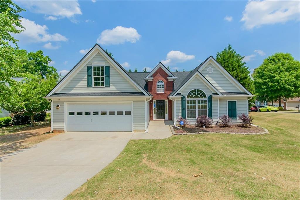 307 Reliance Way Northeast Dacula, GA 30019 - Photo 1 of 1 a front view of a house with a yard