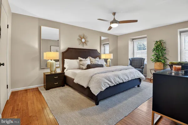 a bedroom with bed and window