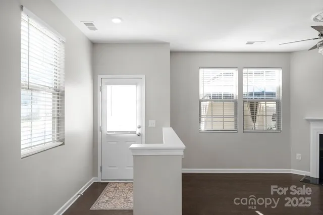 a room with a window and wooden floor