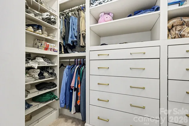 a spacious bathroom with a granite countertop sink and a mirror