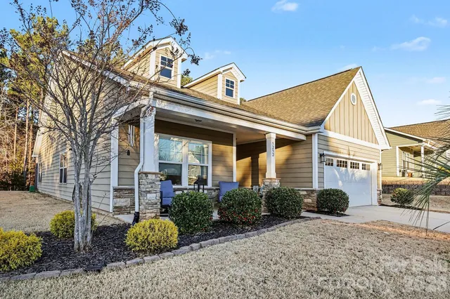 a outdoor living space with furniture and a potted plant
