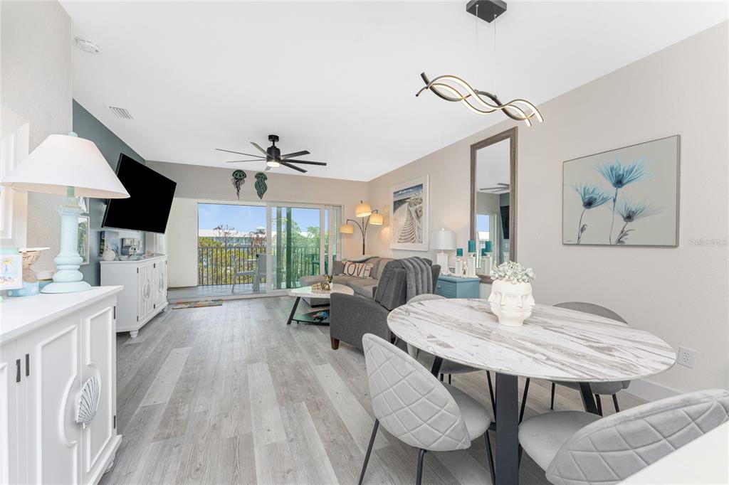 8405 Placida Road, Unit 406 Placida, FL 33946 - Photo 14 of 55 a view of a dining room with furniture window and outside view