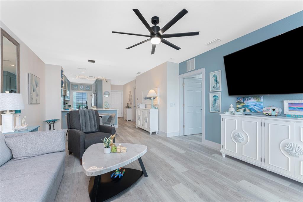 8405 Placida Road, Unit 406 Placida, FL 33946 - Photo 17 of 55 a living room with furniture and a flat screen tv