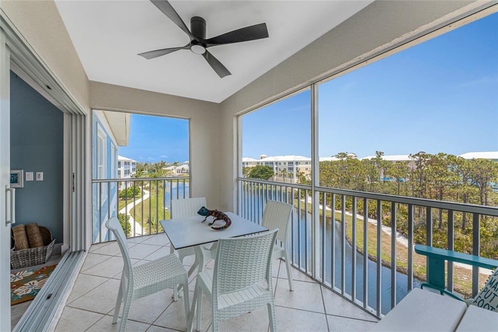 8405 Placida Road, Unit 406 Placida, FL 33946 - Photo 24 of 55 a view of a dining room with furniture window and outside view
